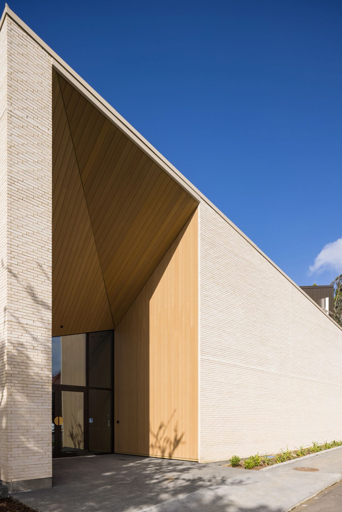 Timber-lined entry soffit at the chapel exterior