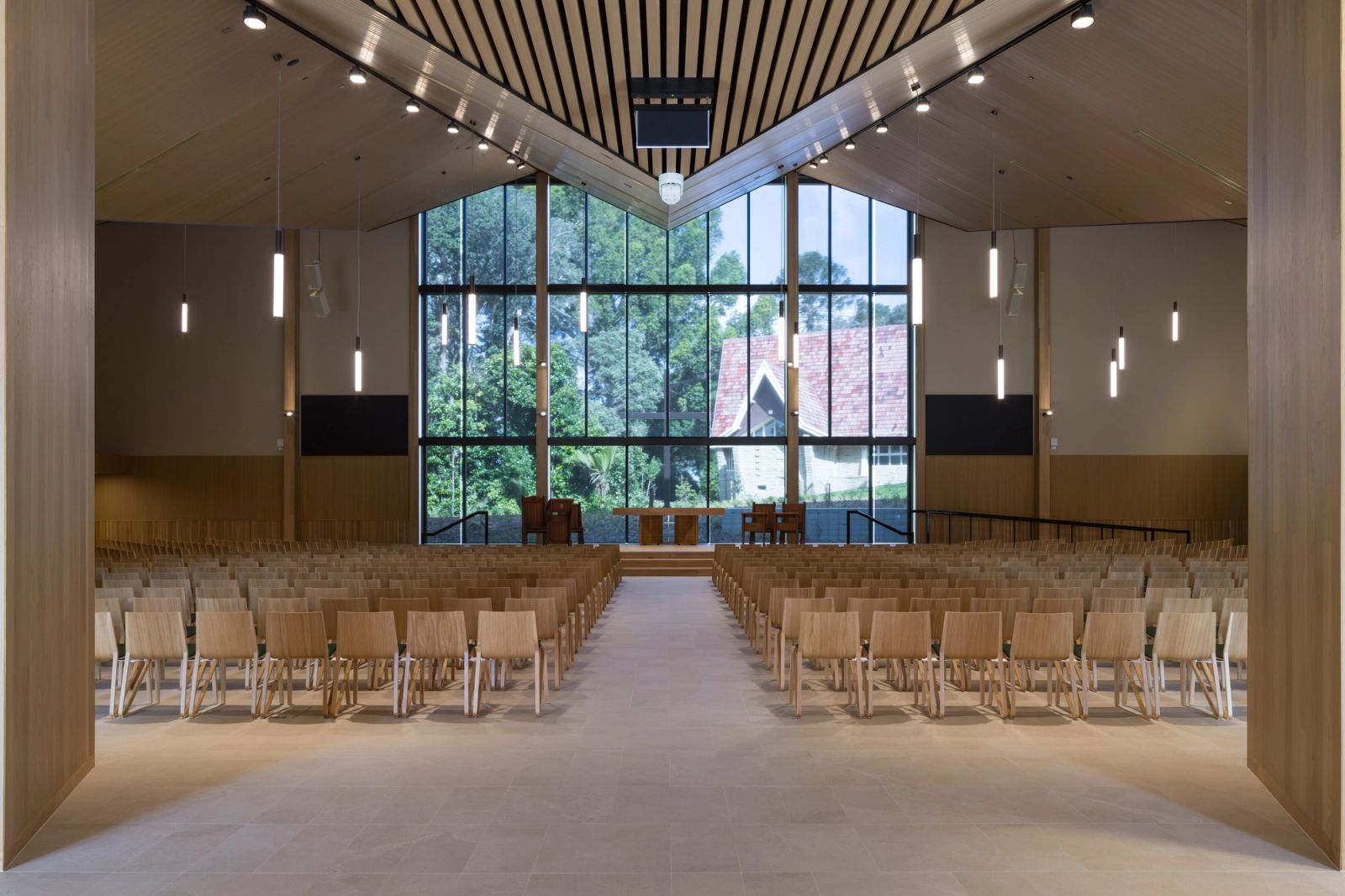 InnoCeil timber ceiling meeting the chapel window wall