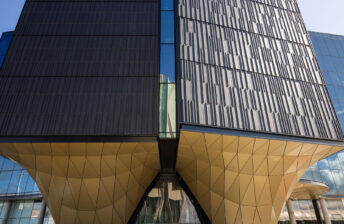 The Pullman - Alucolux in 601 Gold Metallic and terracotta 3d tiles in dark grey_The Building Agency_Cladding Products Facades